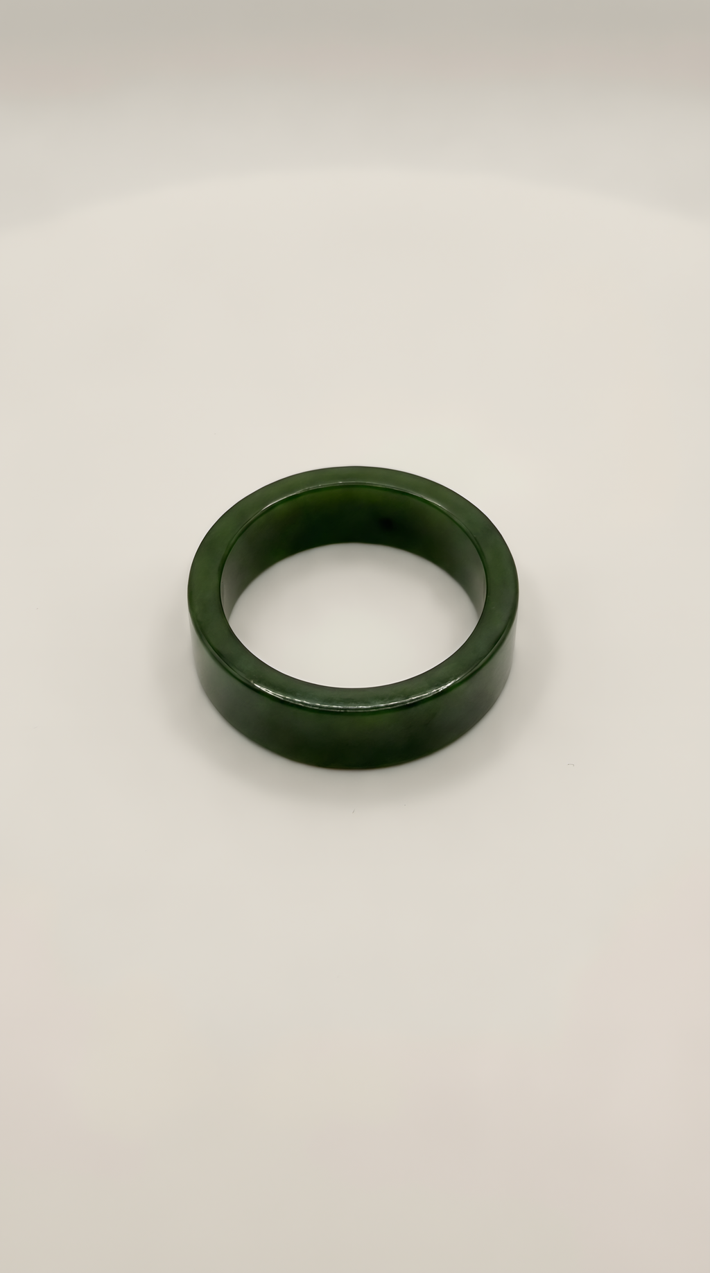 Green nephrite jade flat band ring with smooth finish