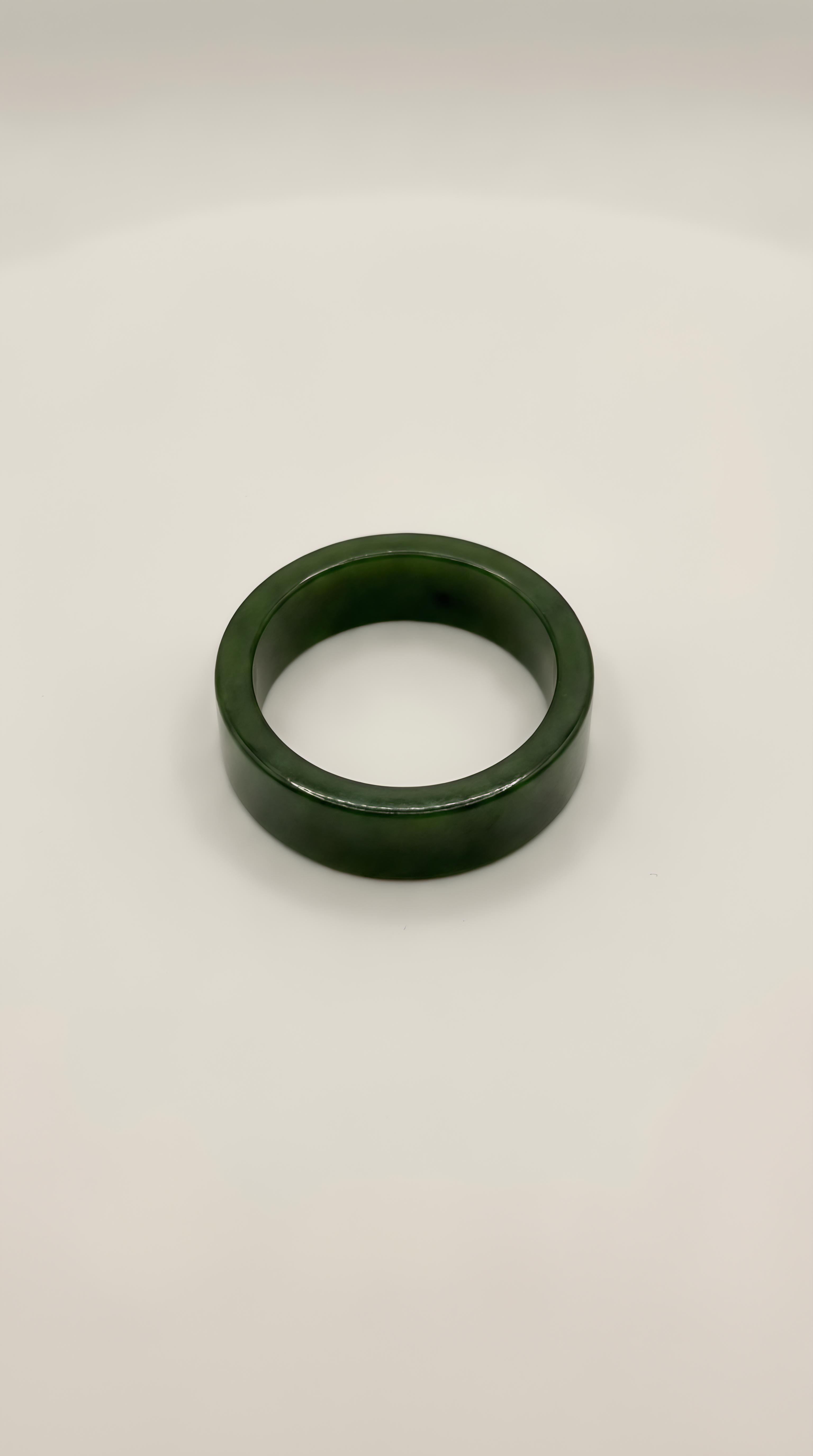 Green nephrite jade flat band ring with smooth finish