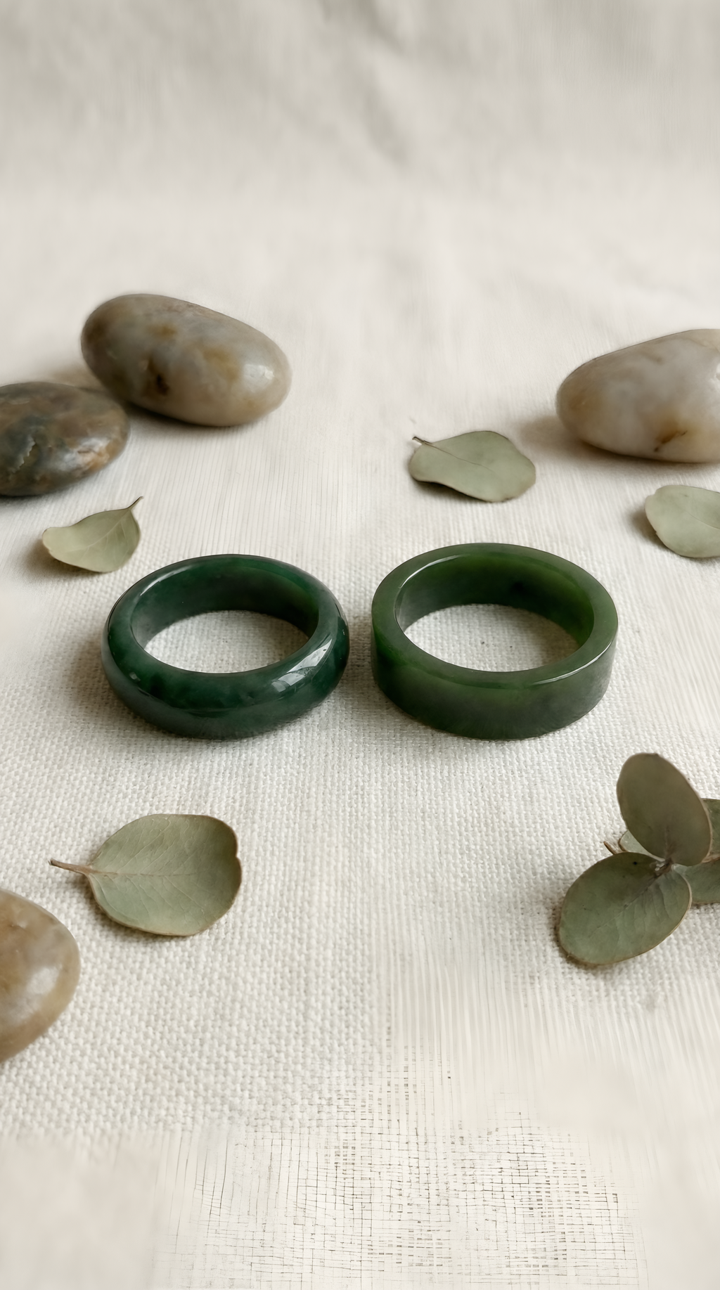 Green jade ring pair showing dome and flat band styles together