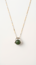 Nephrite jade ball pendant necklace with silver setting on chain