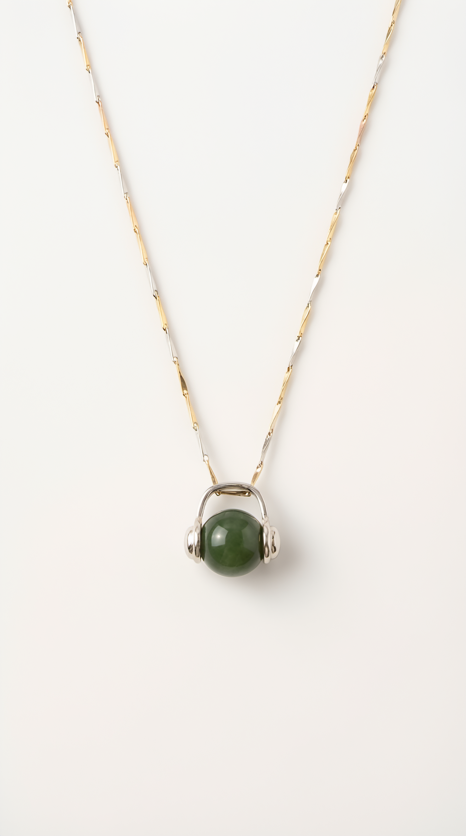 Nephrite jade ball pendant necklace with silver setting on chain