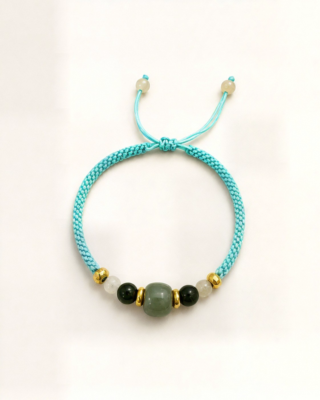 Laguna pairs nephrite jade beads with small agate beads at the sides.