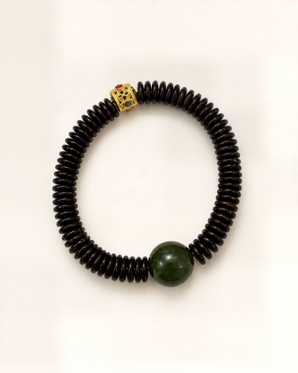 Noche Imperial combines dark bodhi discs with a natural green nephrite jade bead.