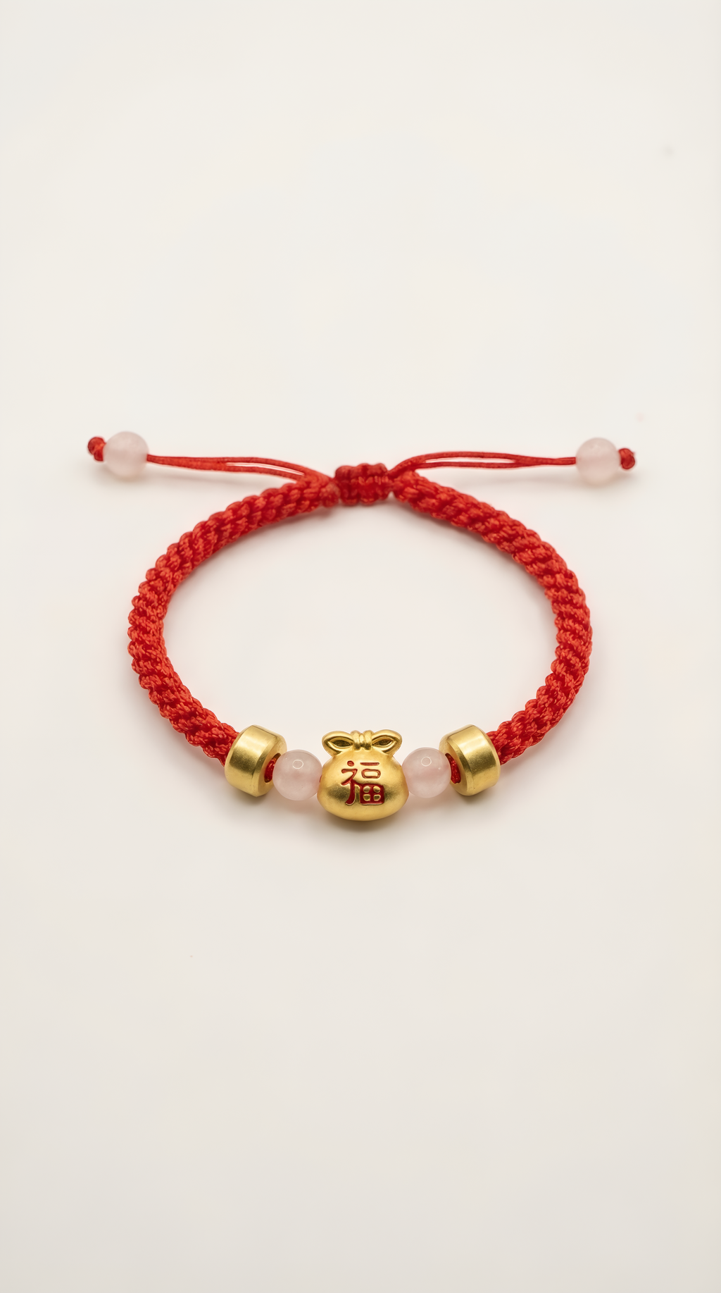 Red string bracelet with gold lucky bag charm