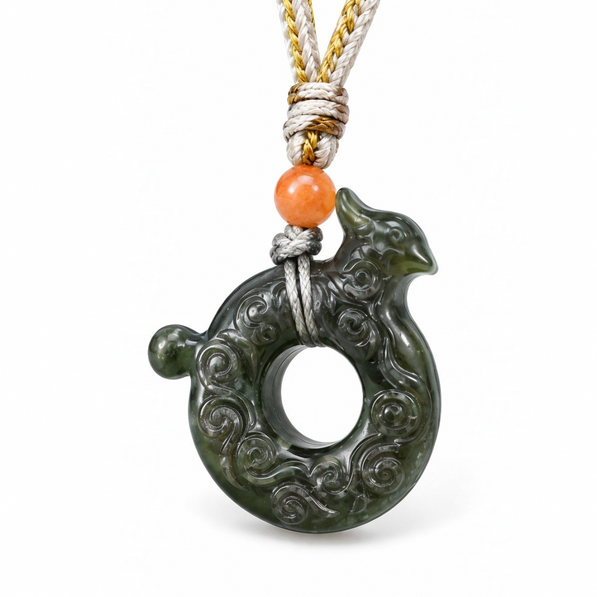 Close-up of the carved phoenix on the circular green nephrite jade pendant.
