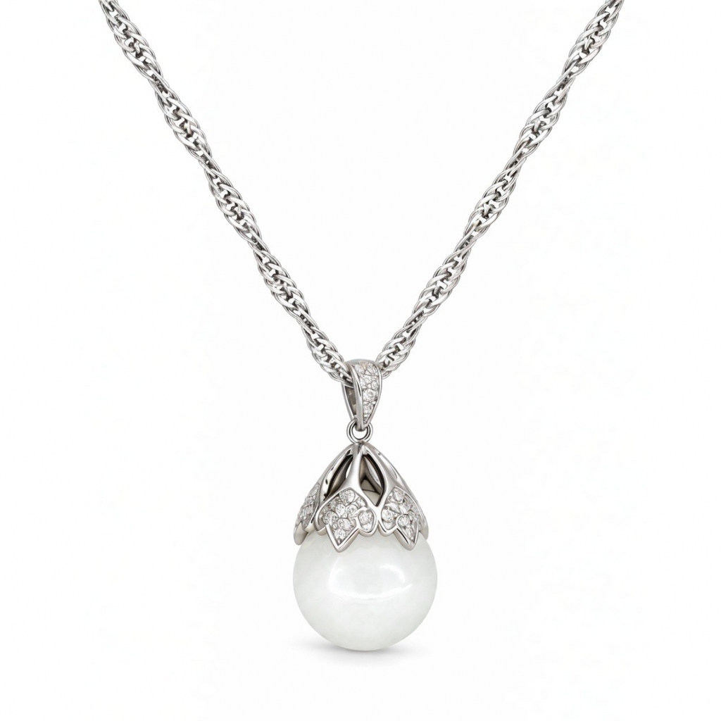 Close-up of the Luna sterling silver floral cap with cubic zirconia over a white nephrite jade sphere.
