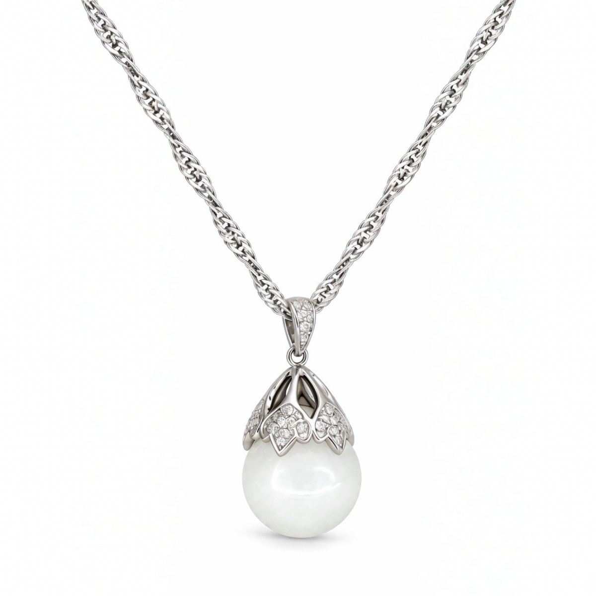 Close-up of the Luna sterling silver floral cap with cubic zirconia over a white nephrite jade sphere.