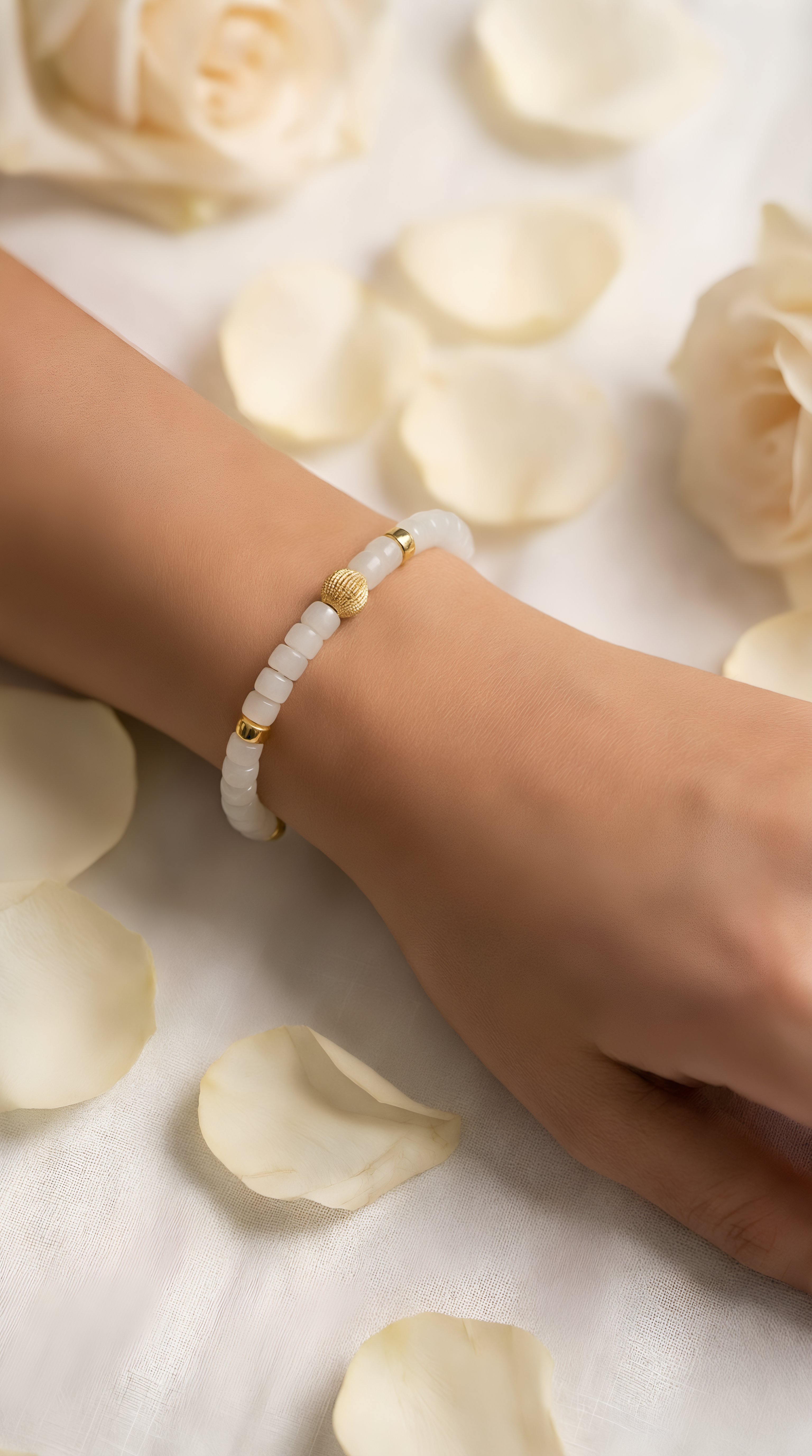 White jade bead bracelet with gold accent bead