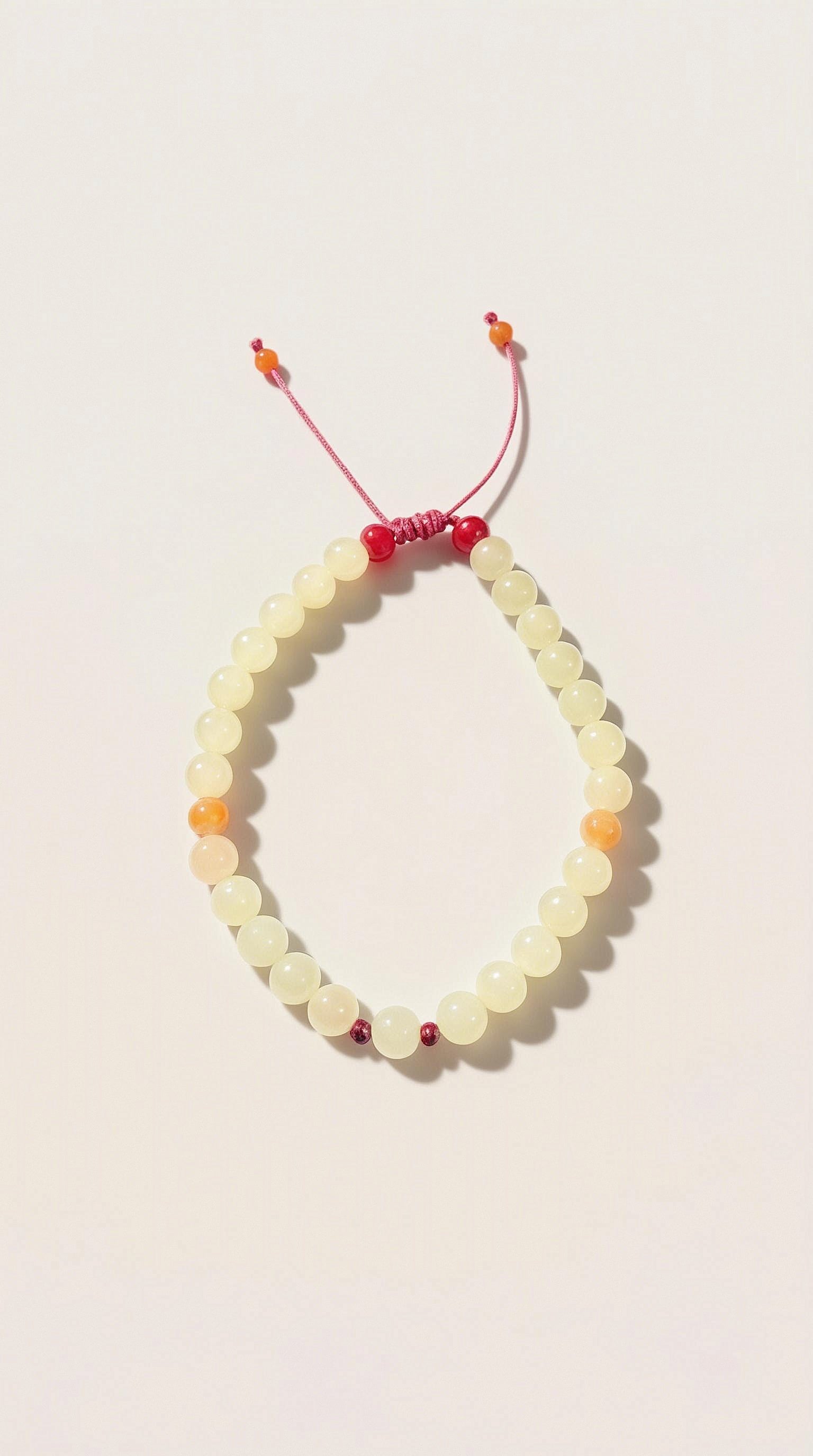 Pulsera de Jade Amarillo con Cordón de Seda Rosa Ajustable